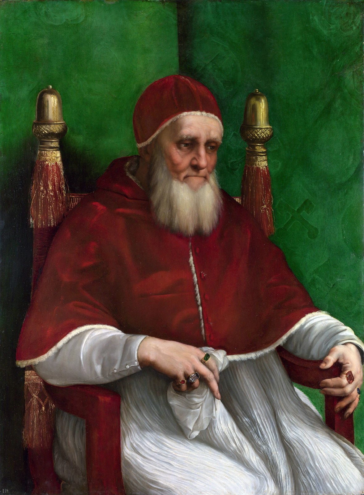 Raphael’s portrait of Pope Julius II as an old man with a long white beard, seated in a red velvet cap and cape, looking down.